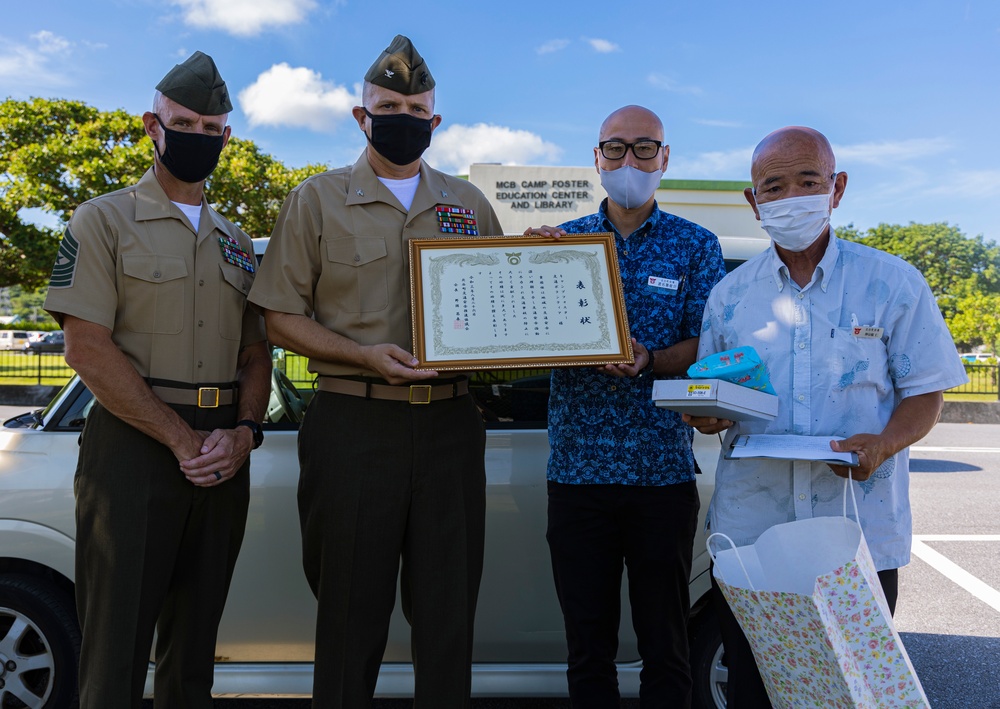 Headquarters and Support Battalion Commanding Officer Receives Award for the crossguard volunteer support across Chatan