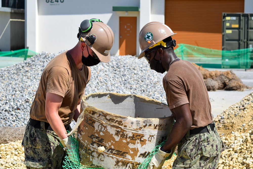 U.S. Navy Seabees assigned to NMCB-5 build a wash-rack
