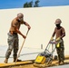 U.S. Navy Seabees assigned to NMCB-5 build a wash-rack