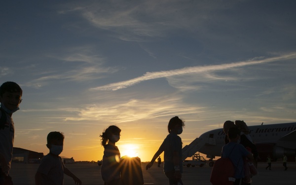 Evacuees depart NAVSTA Rota for the United States