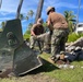 U.S. Navy Seabees with NMCB-5's Detail Marshall Islands place concrete for a church sidewalk