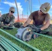 U.S. Navy Seabees with NMCB-5's Detail Marshall Islands place concrete for a church sidewalk