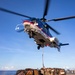 A 330J Puma Helicopter assigned to the USNS Alan Shepard delivers Supplies to USS Barry