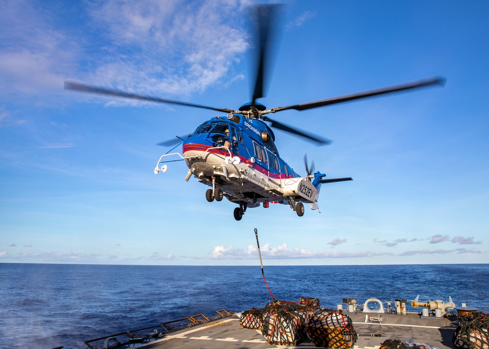 A 330J Puma Helicopter assigned to the USNS Alan Shepard delivers Supplies to the USS Barry