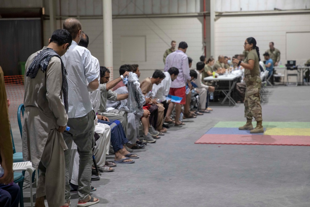 Soldiers Record Afghan Evacuees' Biometrics in Qatar