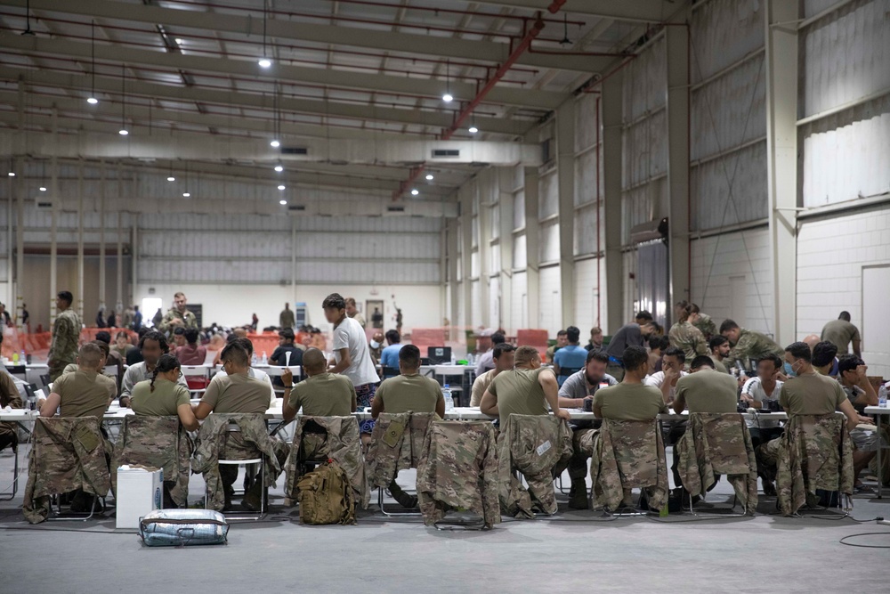 Soldiers Record Afghan Evacuees' Biometrics in Qatar