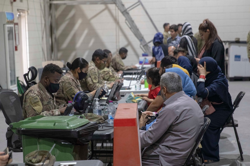 Soldiers Record Afghan Evacuees' Biometrics in Qatar