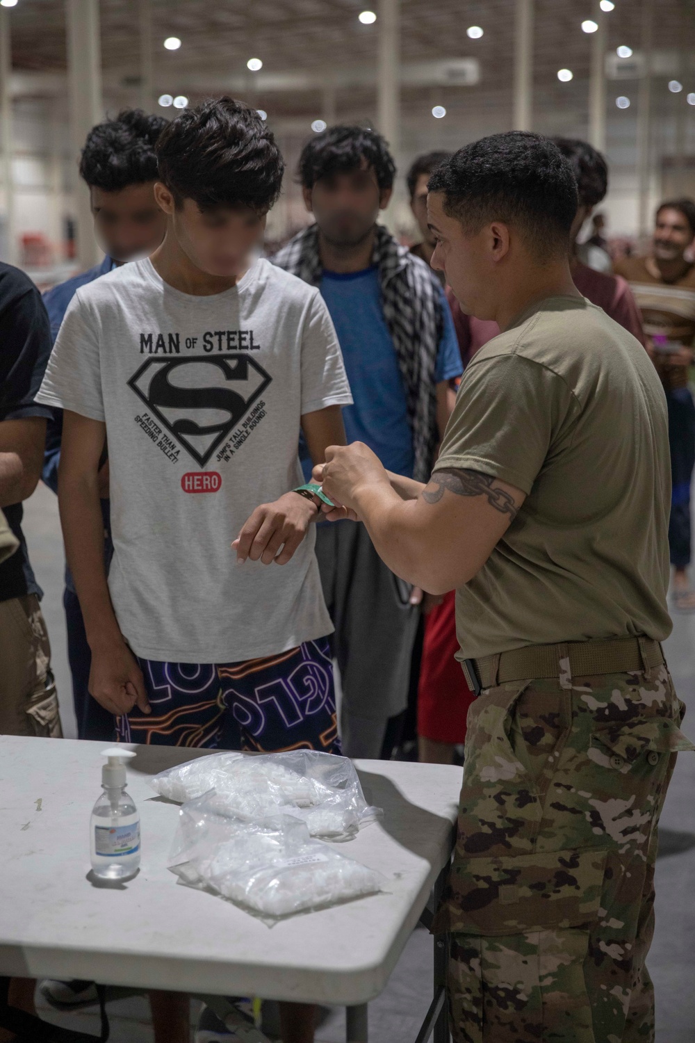 Soldiers Record Afghan Evacuees' Biometrics in Qatar