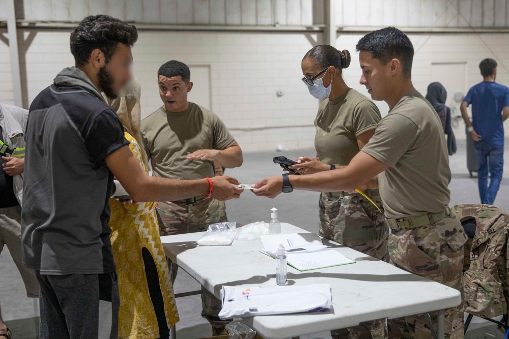 Soldiers Record Afghan Evacuees' Biometrics in Qatar