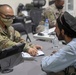 Soldiers Process Afghan Evacuees in Qatar