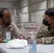 Soldiers Process Afghan Evacuees in Qatar