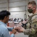 Soldiers Process Afghan Evacuees in Qatar