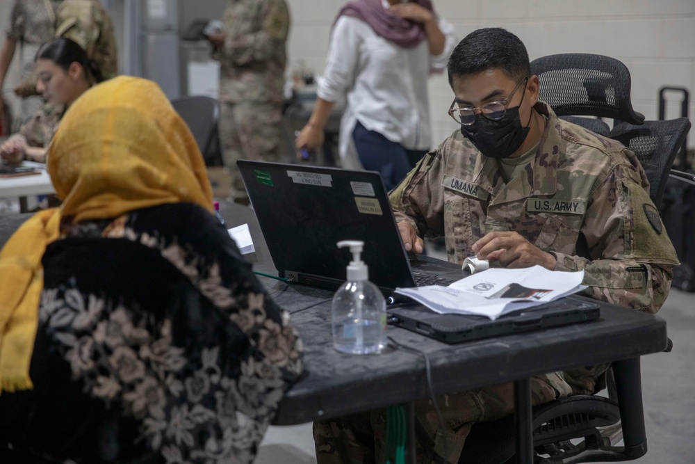 Soldiers Process Afghan Evacuees in Qatar