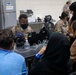 Soldiers Process Afghan Evacuees in Qatar
