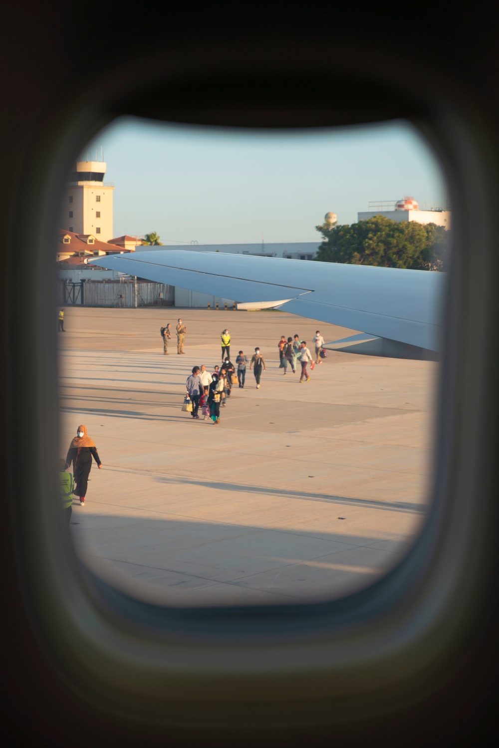 Evacuees depart NAVSTA Rota for the United States