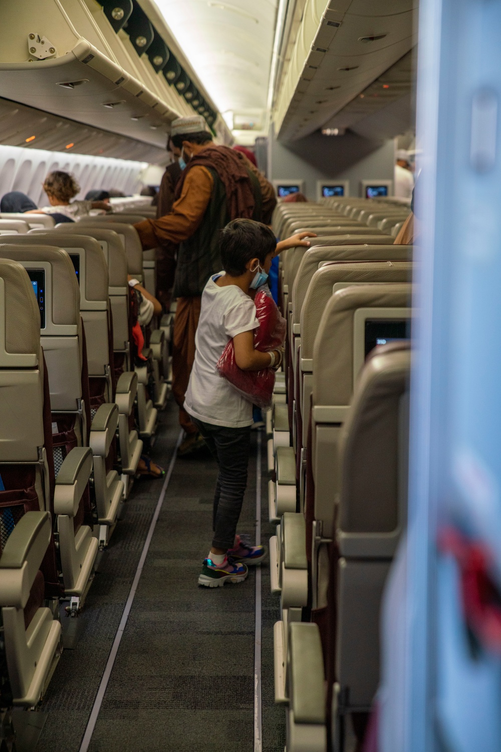 Evacuees depart NAVSTA Rota for the United States