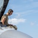 Avionics technician preforms a preflight check on a F-16 Fighting Falcon