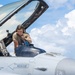 Avionics technician preforms a preflight check on a F-16 Fighting Falcon