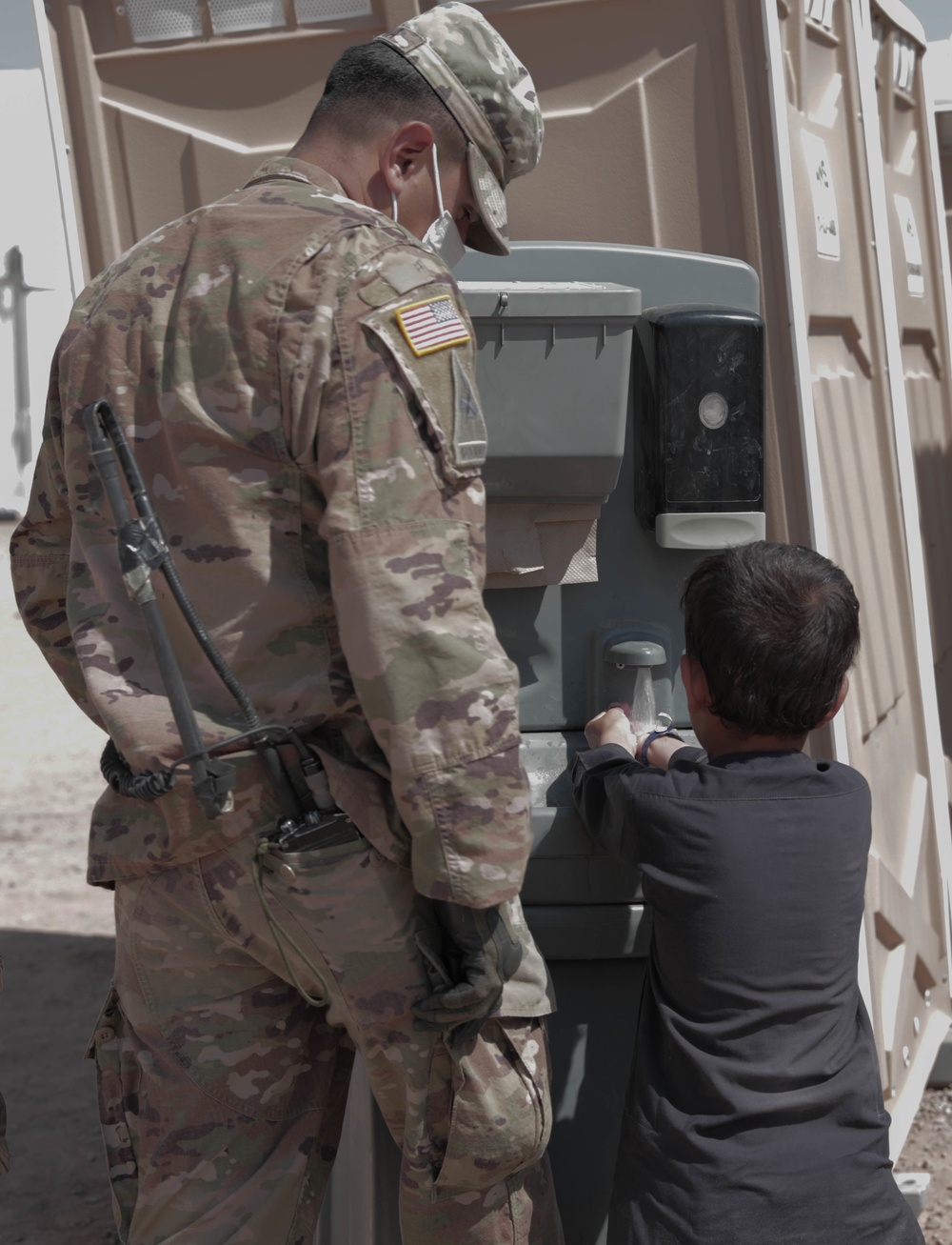 1st Armored Division Soldiers keep Afghan children in high spirits