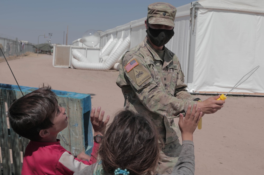 1st Armored Division Soldiers keep Afghan children in high spirits