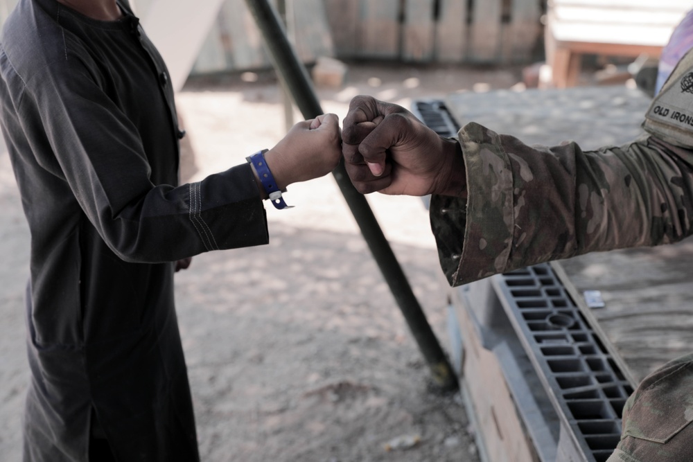 1st Armored Division Soldiers keep Afghan children in high spirits