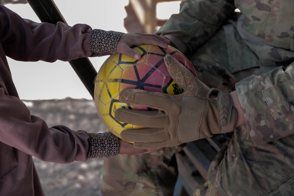 1st Armored Division Soldiers keep Afghan children in high spirits