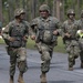 Soldiers run to their firing lanes during a pistol firing event at the Florida National Guard's annual TAG Match