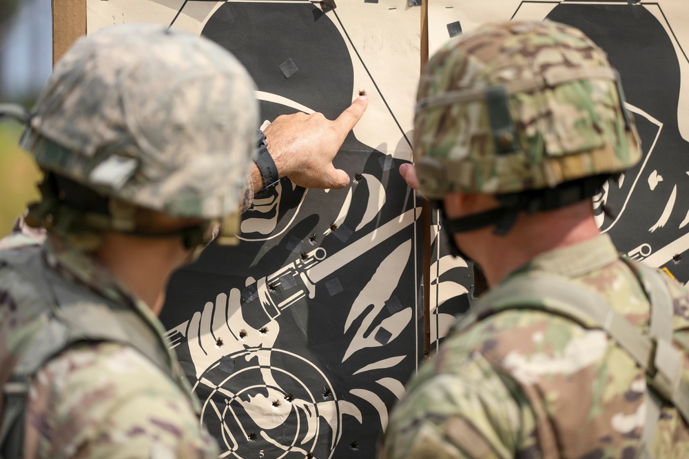 A firing team evaluate their shot groupings at the Florida Army National Guard's annual TAG Match