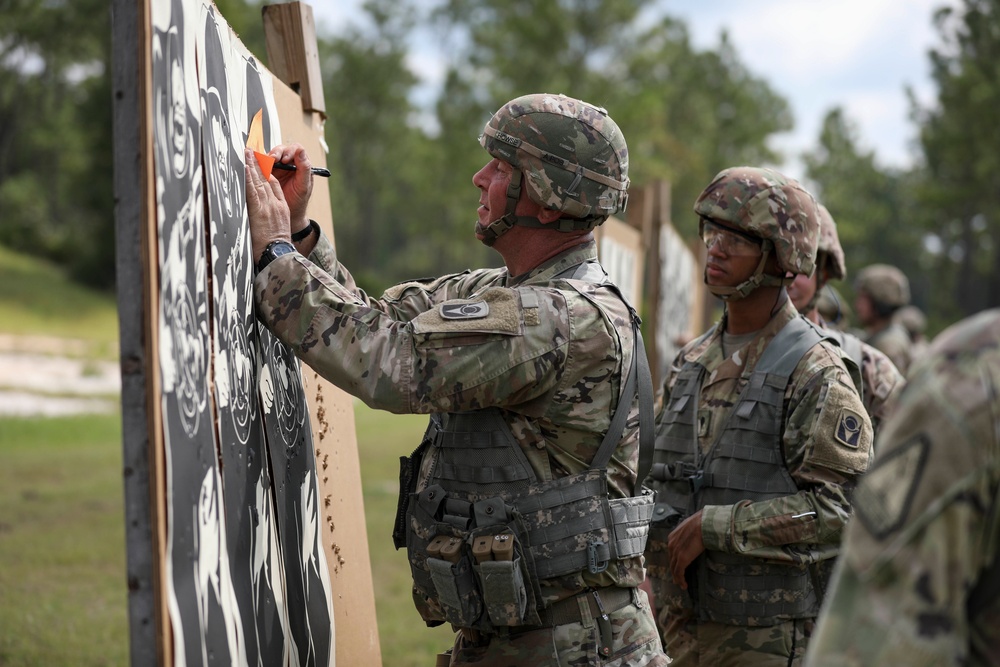 Florida National Guard NCO evaluates shots on a target at 2021 TAG Match