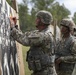 Florida National Guard NCO evaluates shots on a target at 2021 TAG Match