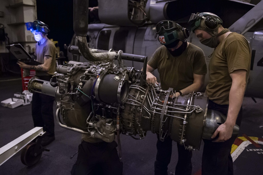 Helicopter Sea Combat Squadron (HSC) 4 Installs Helicopter Engine