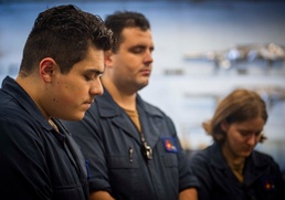 GHWB Sailors Bow their Heads in Silence