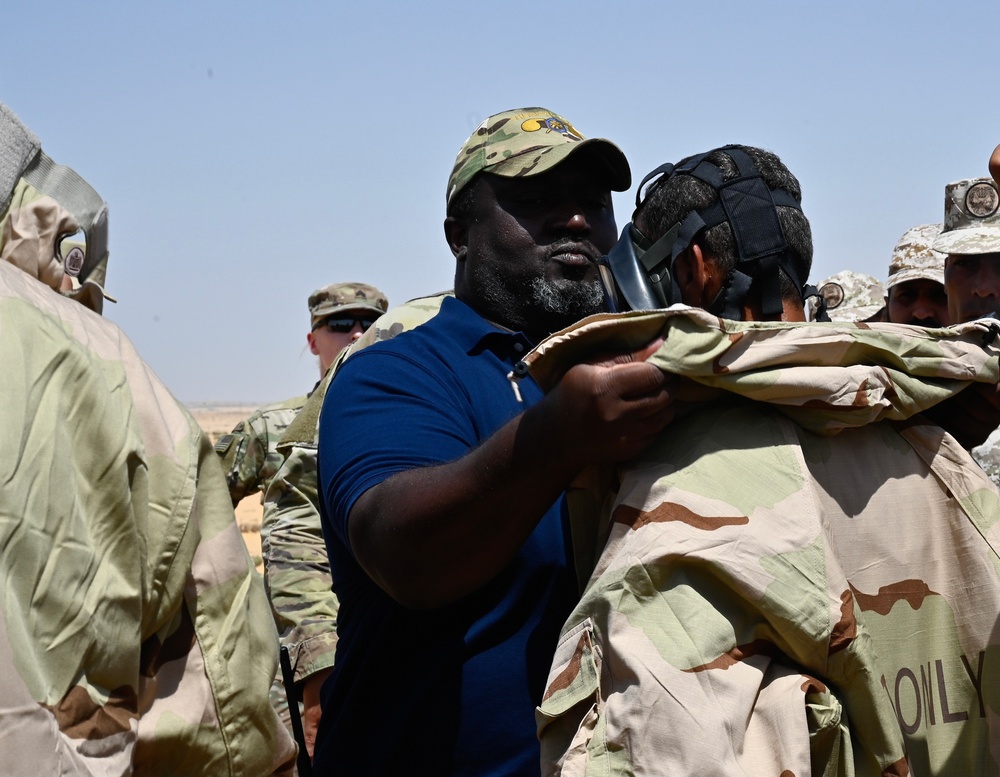 U.S. Army Soldiers partner with Jordanian and Egyptian CBRN specialists to execute the stages of decontamination