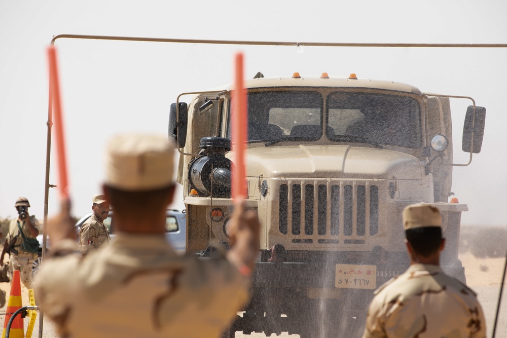 U.S. Army Soldiers partner with Jordanian and Egyptian CBRN specialists to execute the stages of decontamination