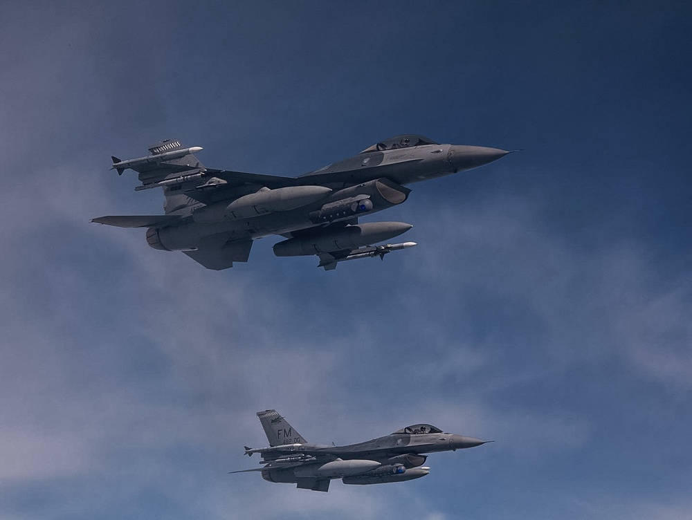 927th Airmen watch the refueling of F-16s