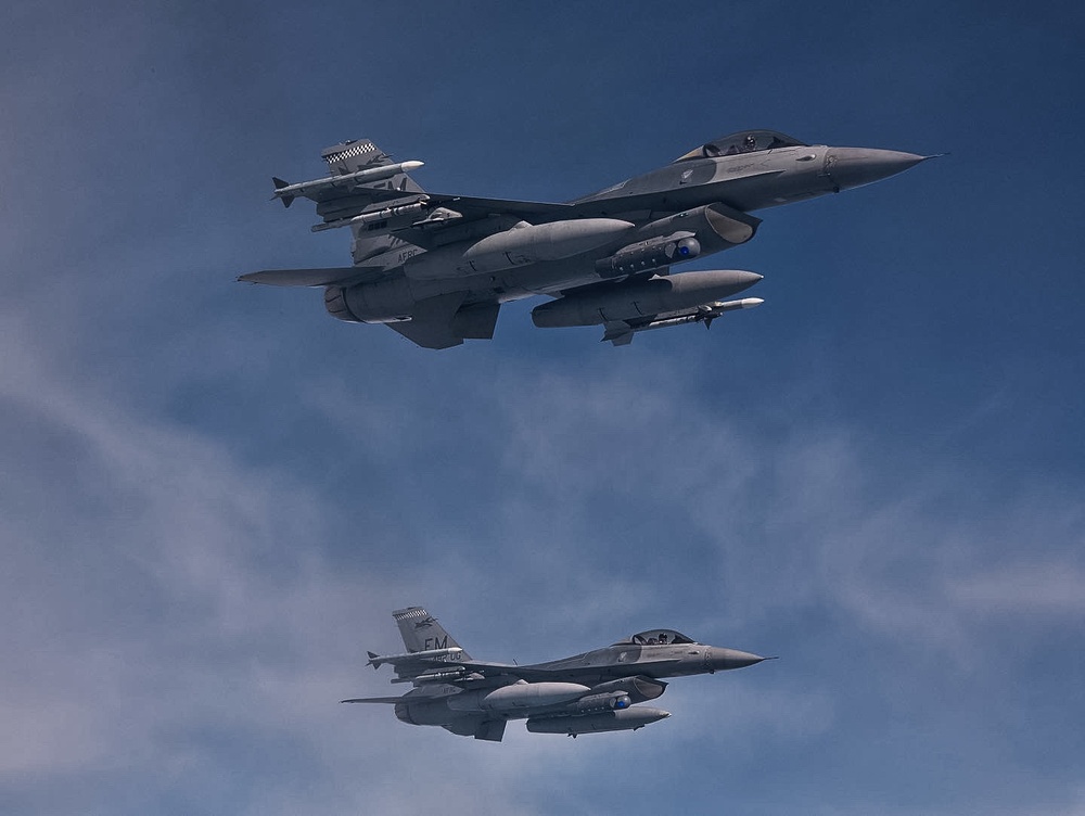 927th Airmen watch the refueling of F-16s