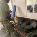 7th Engineer Support Battalion Marines install a new deadlift bar