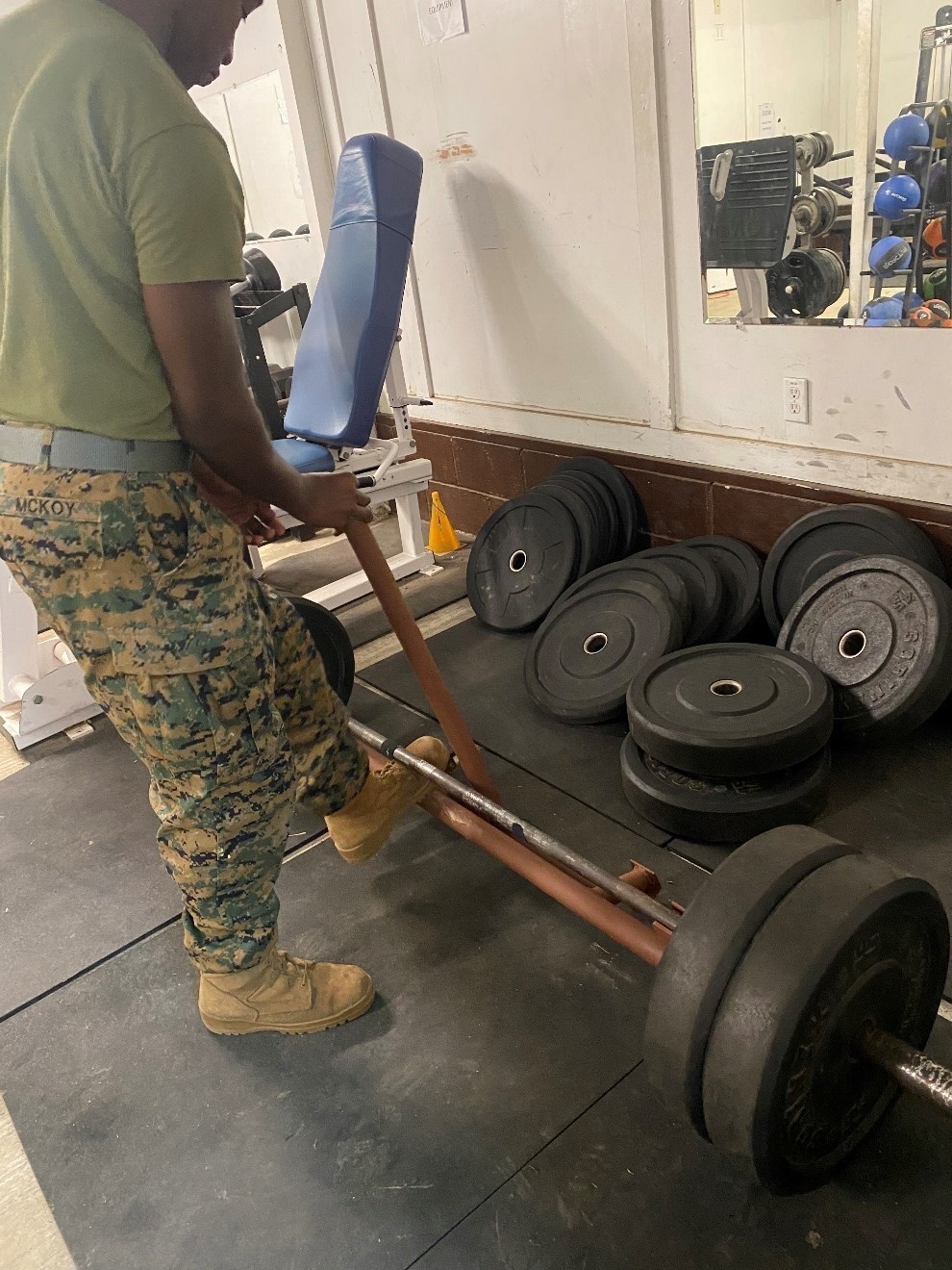 7th Engineer Support Battalion Marines install a new deadlift bar