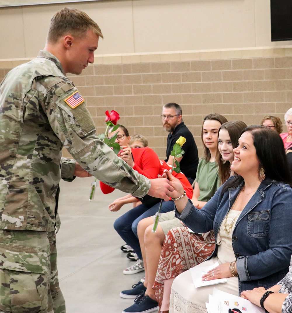 A ‘family business’: top enlisted leader of Iowa brigade passes unit colors to brother