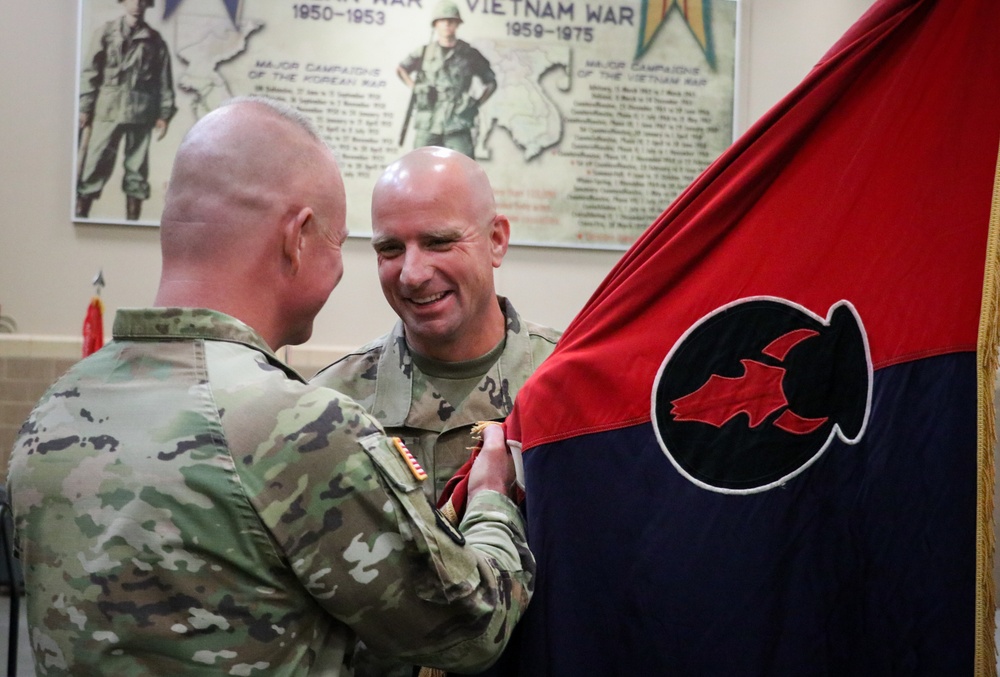 A ‘family business’: top enlisted leader of Iowa brigade passes unit colors to brother