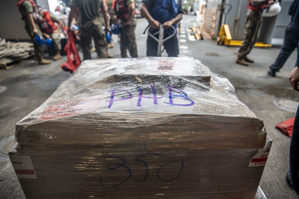 U.S. Marines, Sailors with 11th MEU, USS Pearl Harbor receive cargo