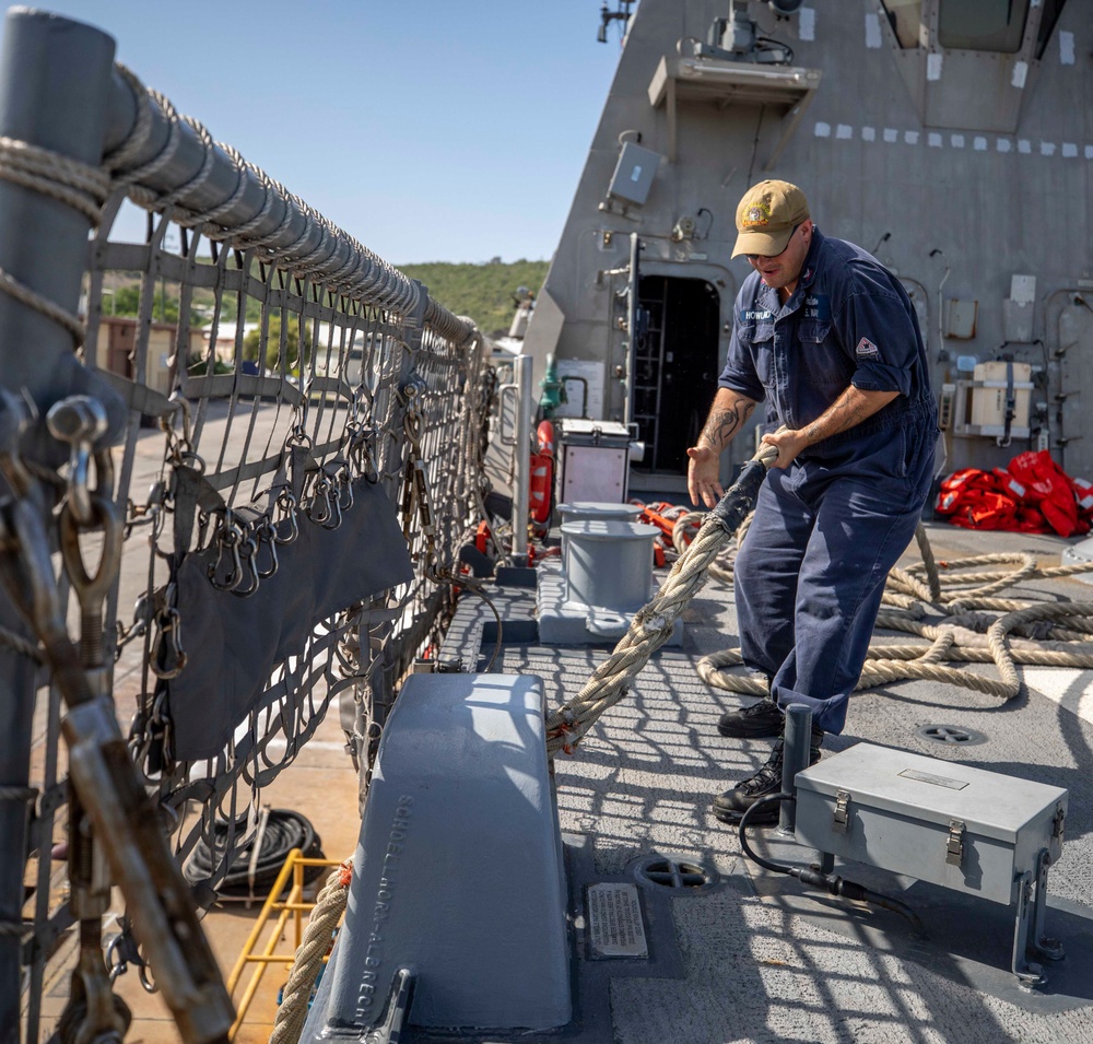 USS Billings Sailor Heaves Around a Line During Sea and Anchor Detail