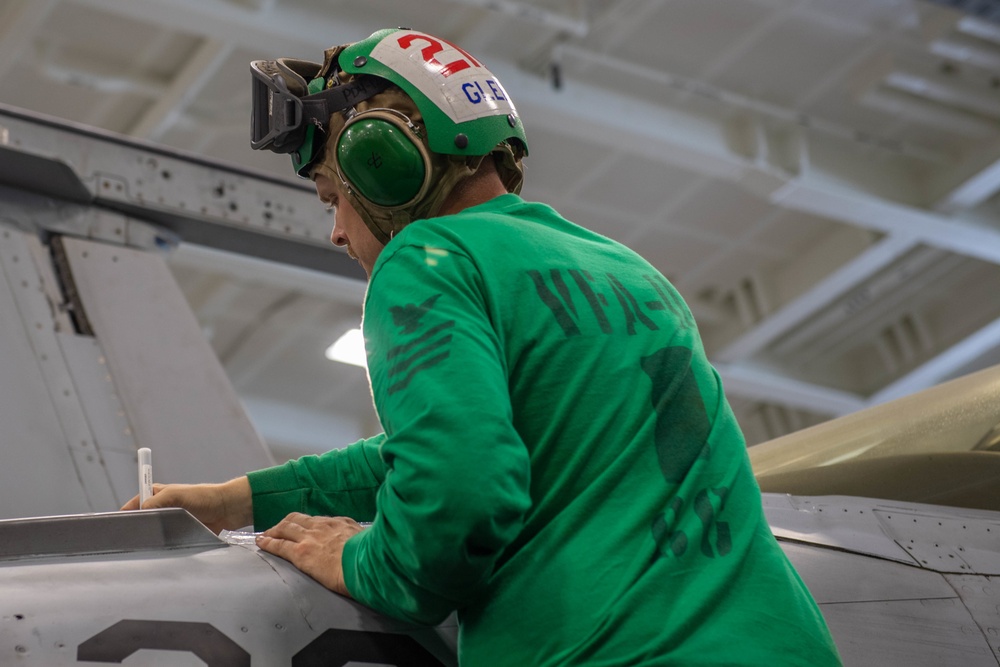 USS Carl Vinson (CVN 70) Sailor performs corrective maintenance