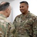 Lt. Gen. Paul Calvert coins Soldiers of Task Force Phoenix at Camp Buehring