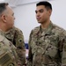 Lt. Gen. Paul Calvert coins Soldiers of Task Force Phoenix at Camp Buehring