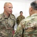 Lt. Gen. Paul Calvert coins Soldiers of Task Force Phoenix at Camp Buehring