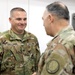Lt. Gen. Paul Calvert coins Soldiers of Task Force Phoenix at Camp Buehring