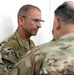 Lt. Gen. Paul Calvert coins Soldiers of Task Force Phoenix at Camp Buehring