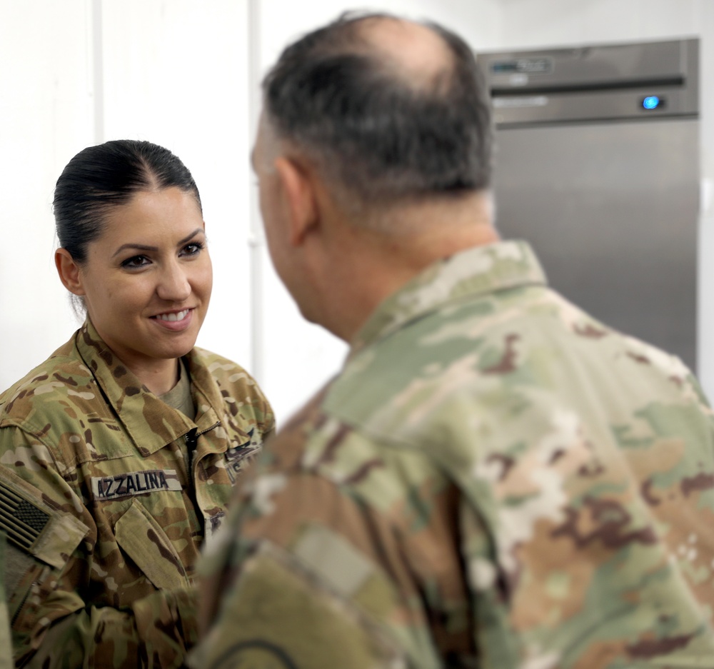 Lt. Gen. Paul Calvert coins Soldiers of Task Force Phoenix at Camp Buehring