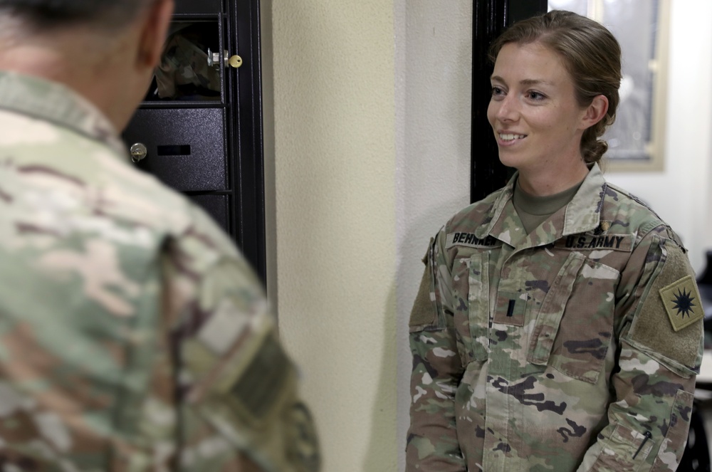 Lt. Gen. Paul Calvert coins Soldiers of Task Force Raptor at Camp Buehring